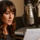 German voice over artist recording at Neumann U87 microphone, focused on script in professional Berlin studio German voice over artist recording at Neumann U87 microphone, focused on script in professional Berlin studio